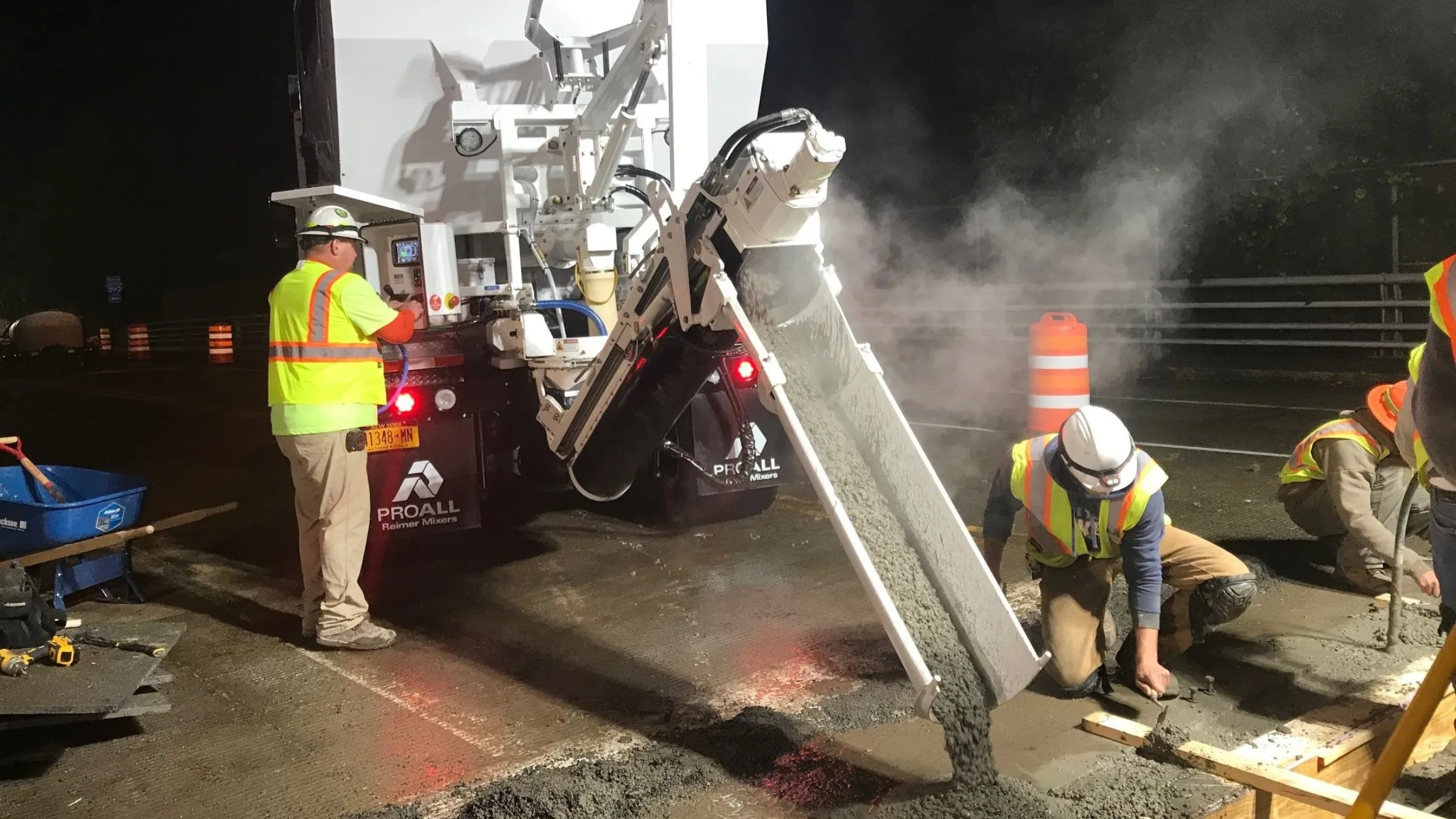 Image of mobile concrete mixer with crew performing infrastructure work
